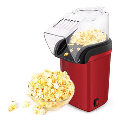 Aparat de făcut popcorn roșu elegant cu bol de popcorn proaspăt preparat alături.