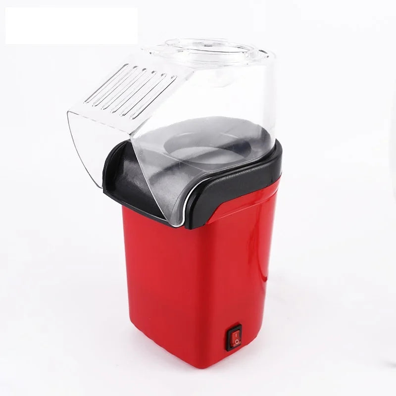 Aparat de făcut popcorn cu design compact și modern, ideal pentru uz casnic.