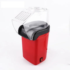Aparat de făcut popcorn cu design compact și modern, ideal pentru uz casnic.